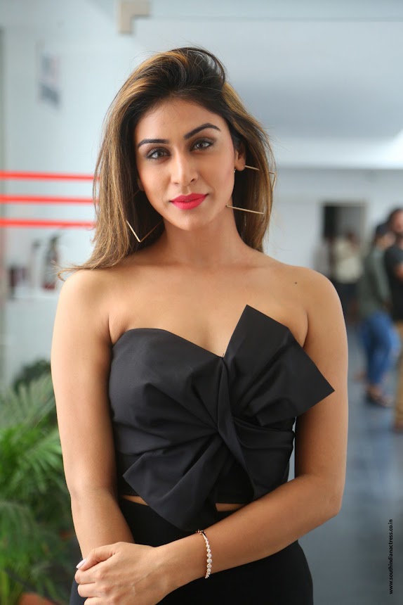 Myra Sareen spicy pics in black off shoulder short dress at Officer movie Press Meet