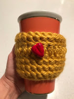 yellow cup cozy with heart bead 