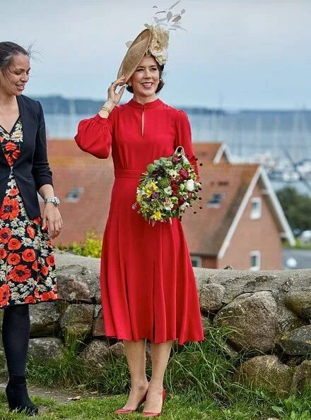 Crown Princess Mary wore Raquel Diniz Armonia silk-georgette dress. Danish flag