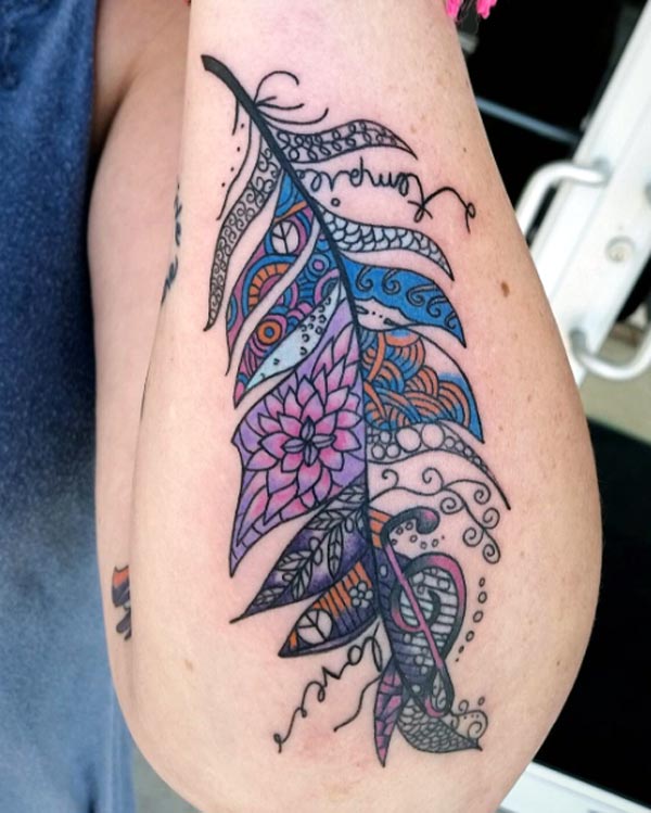 The most gorgeous lace feather tattoo with music symbol eye catching colorful tattoo designs