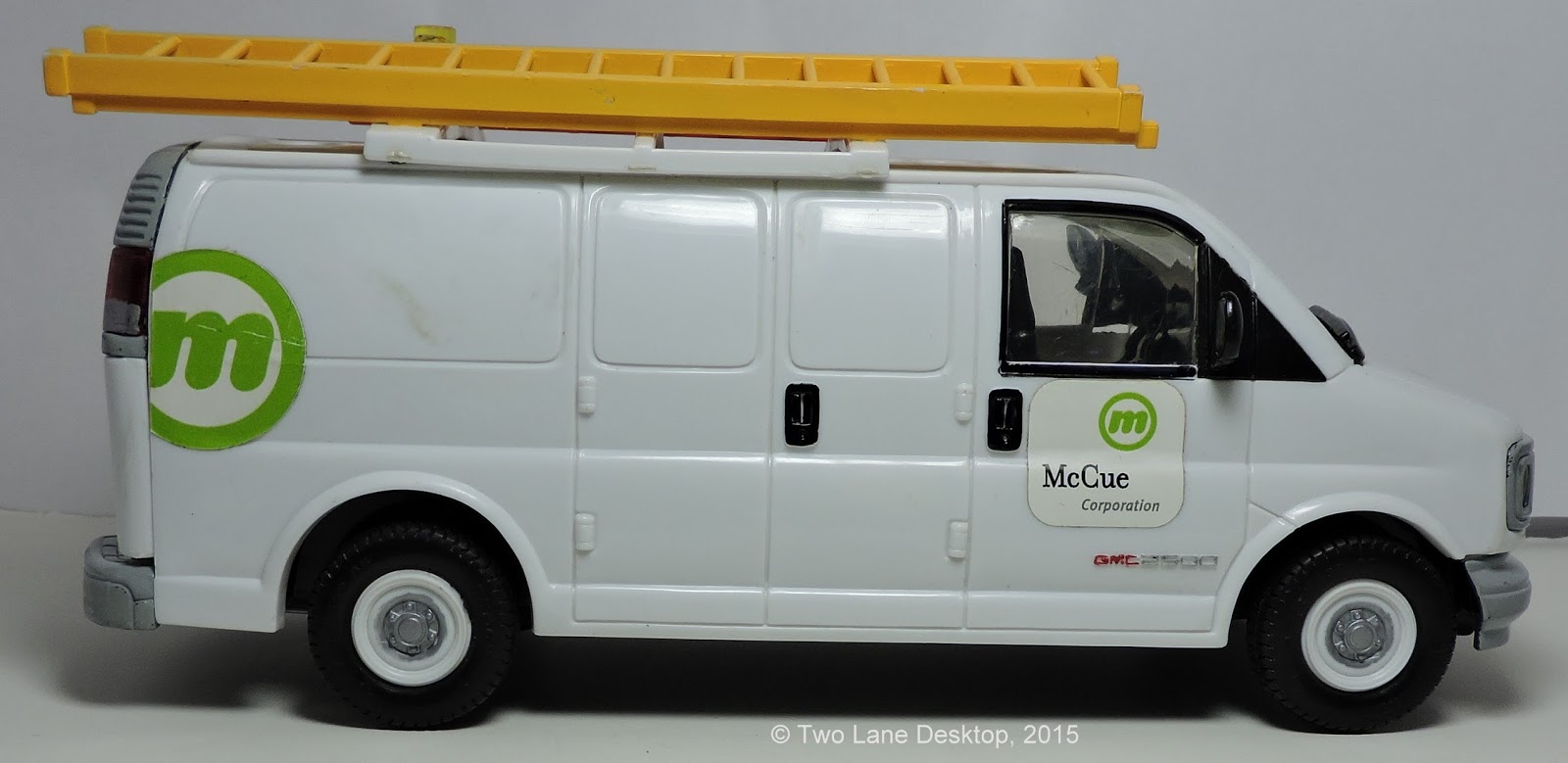 124 GMC Savana work van, Brookfield Chevy Express van, and Johnny Lightning and Maisto Chevy