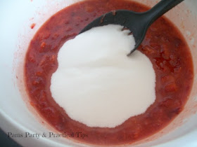 adding sugar while making jam 