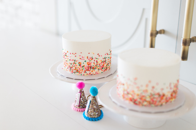 First Birthday Cake Smash, twins first birthday, first birthday party hat, first birthday party, sprinkles birthday party, confetti birthday party, cake smash, sprinkles cake, little blue olive party hat, one eleven east, twin birthday, twin photography, baby photography, modern baby photoshoot, modern baby birthday party, modern birthday party, jesse coulter, hanna andersson, baby style, baby fashion, kids birthday party, boy girl twins