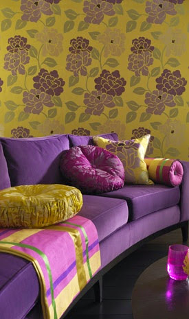 plum and gold cushions with gold floral print wallpaper