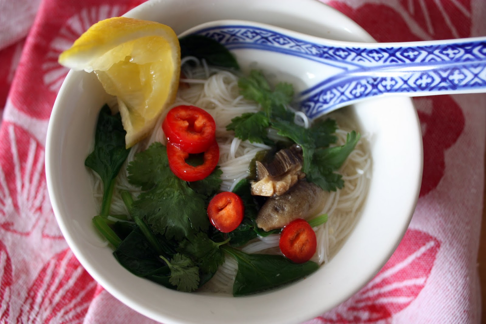 we eat. happy. miso soup. with rice noodles & spinach.