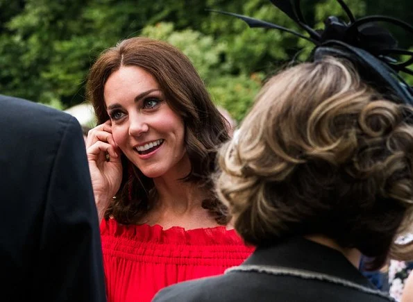 Kate Middleton's dress is by Alexander McQueen Off-the-shoulder shirred cotton and silk-blend. Simone Rocha Crystal earrings, Prada Pumps, Club Monaco Channon Heeled Sandal