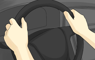 The two hands on controlling wheel 