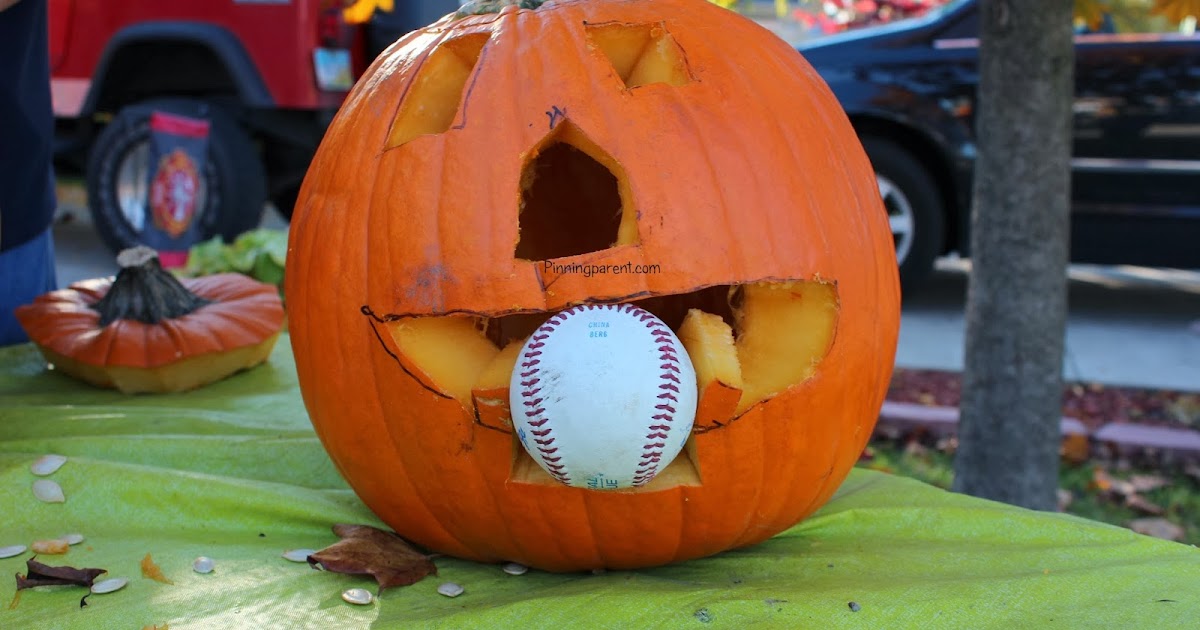 Halloween Pumpkin Eating a Baseball