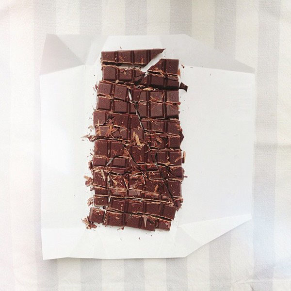 chocolate bar in squares, on gray stripes