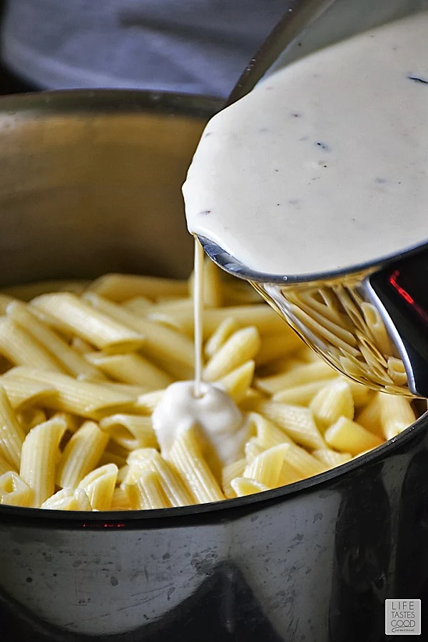 Adding cheese sauce to pasta - Margherita Penne Pasta