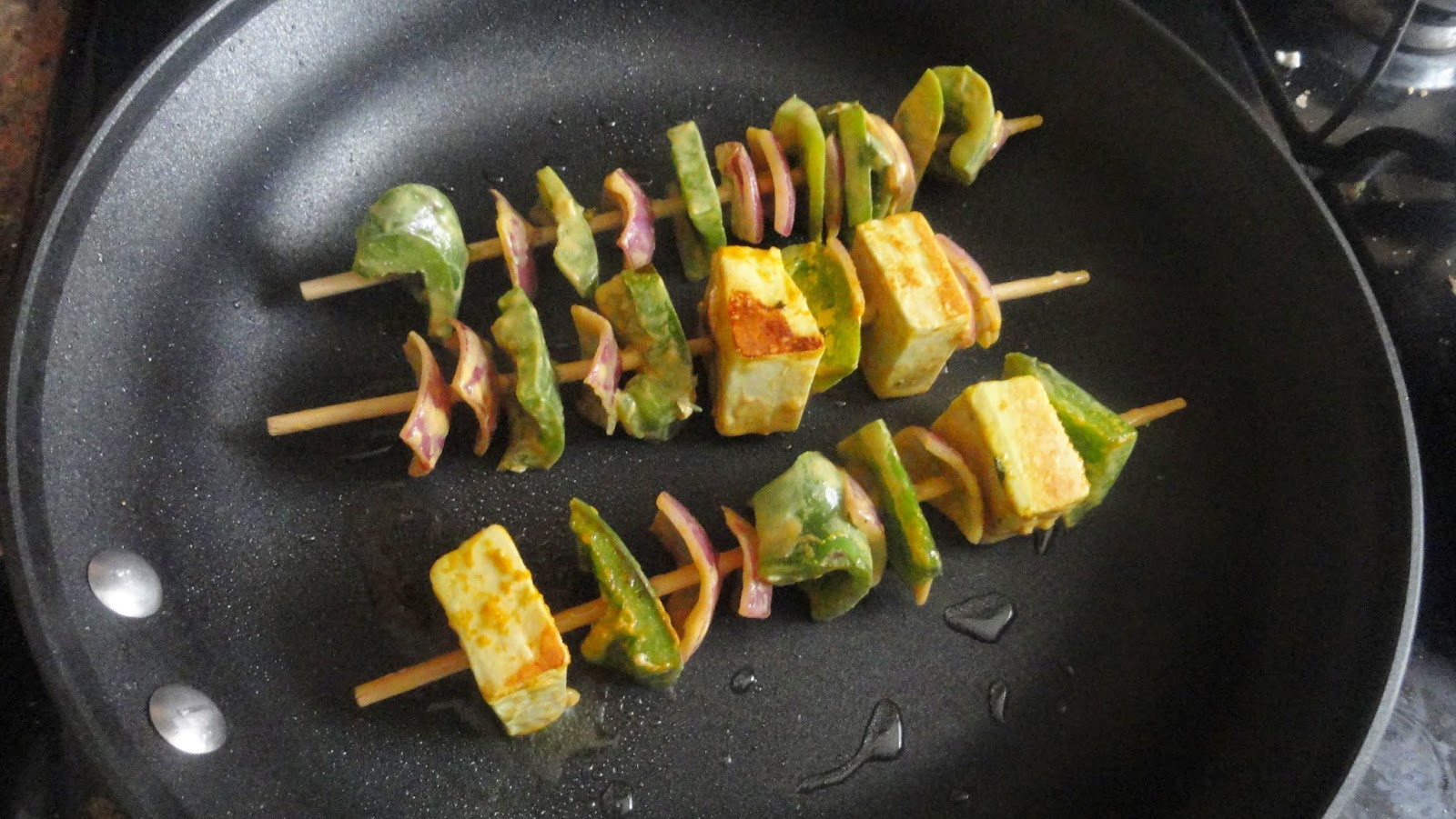 Place the skewers in pan with oil