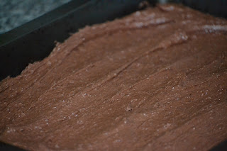 Chocolate brownie mixture in the pan