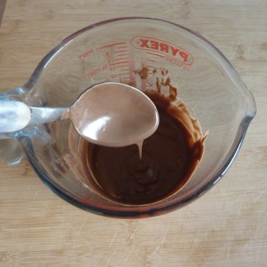 melted baking chocolate in a pyrex glass jug