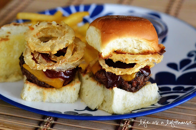 Western Cheeseburger Sliders are juicy miniature hamburgers loaded with barbecue sauce, cheese and crispy onion strings. Life-in-the-Lofthouse.com