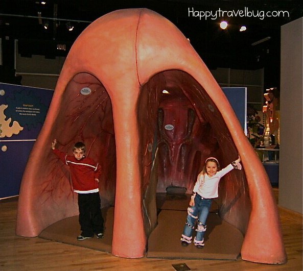 The kids inside a giant fake nose