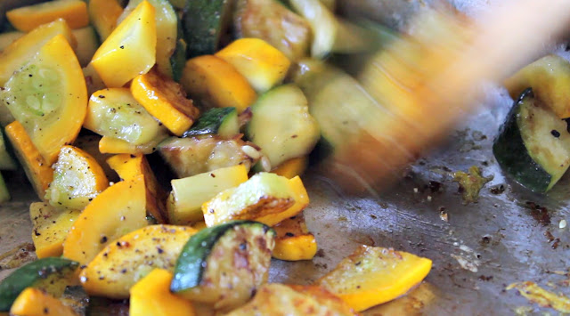 Stirring browned zucchini and summer squash in skillet