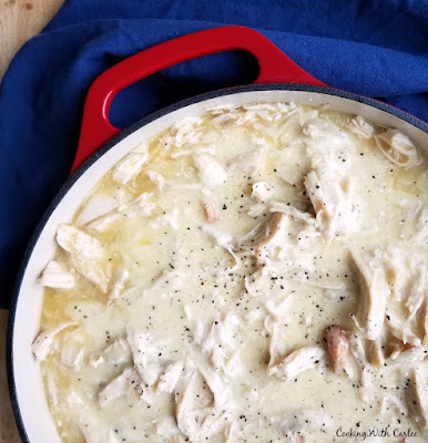 Creamy chicken and gravy in the slow cooker is like making a plate of diner comfort food at home. It is so easy to make and will make you feel are warm and full inside! pan of chicken in creamy gravy