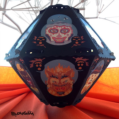 Vintage-style paper lantern by Bindlegrim features six creepy characters for Hallowen - clown, devil, witch, cat, pumpkin, & scarecrow.