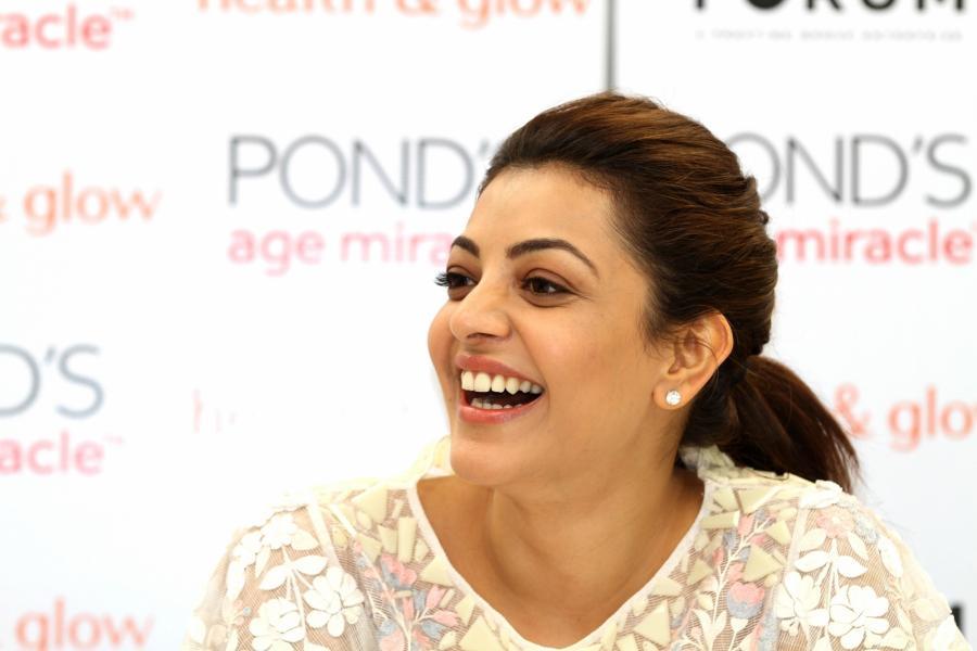 Actress Model Kajal Aggarwal Smiling Stills In White Dress