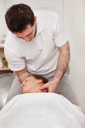 Woman receiving massage therapy to relieve her anxiety.
