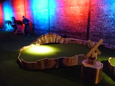 Playing hole 6. Noticed the Windmill on the drinks table - there's one for each of the nine holes Swingers Crazy Golf in Shoreditch, London