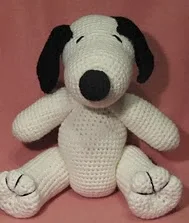 http://www.ravelry.com/patterns/library/crocheted-snoopy-lookalike-amigurumi
