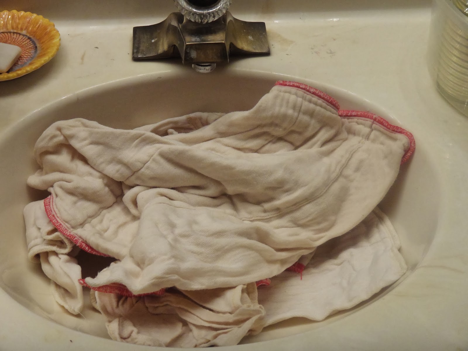 Cleaning, Clutter, and Emily Washing cloth diapers... in the sink... with plain hotel soap