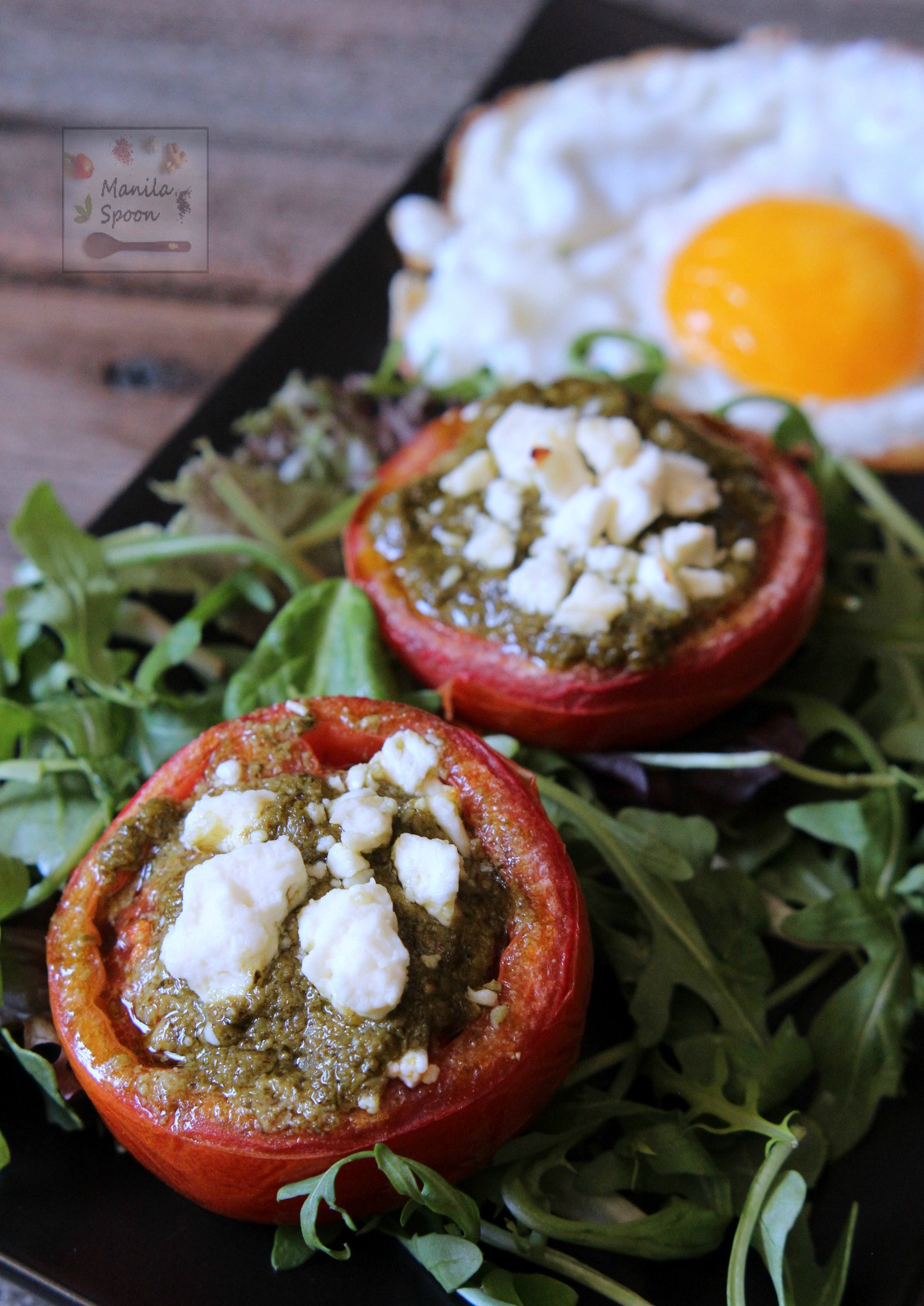 Deliciously good, easy and healthy breakfast or brunch solution - Baked Tomatoes with Pesto and Feta Cheese. Completely gluten-free and low-carb, too! | manilaspoon.com