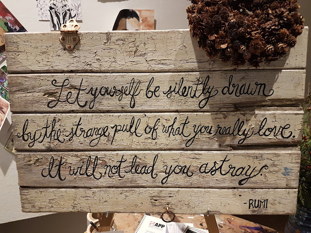 hand painted wooden sign with saying