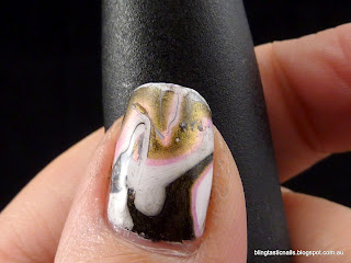 Pink, white and black water marble effect mani