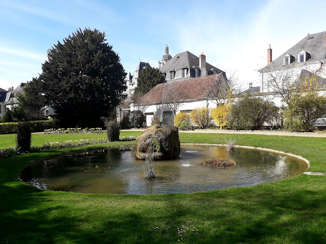 fountain and pond in the public gardens at Loches 