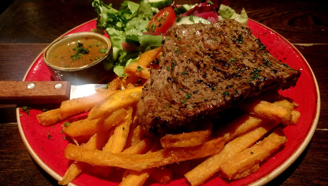 Steak and sweet Potato Fries with a Side Salad from Chiquito. 