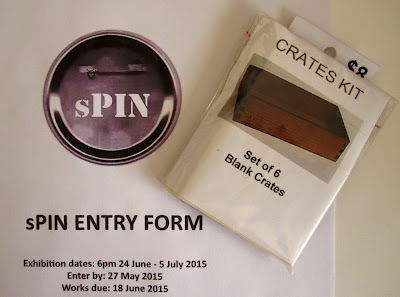 Packet of 1/12th scale dolls house miniature crate kits on top of an application form for the sPIN exhibition.