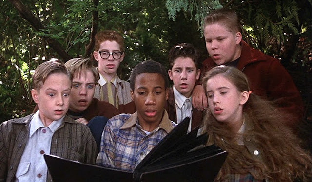 In Stephen King's "IT"(1990), the group of young friends see Pennywise the clown appearing alive in a photobook!