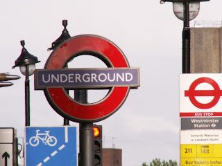 sign for the london underground and bus