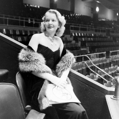 C.Z. Guest in 1947 seated wearing a fur stole