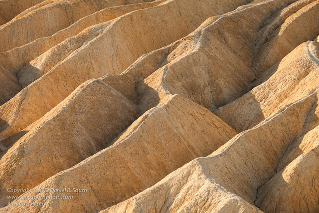 a photo of geometric patterns in the badlands at zabriskie point