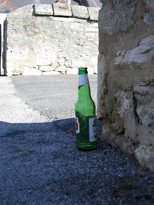 Bottle by wall