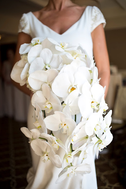 A bodacious bouquet of pure, white orchids.