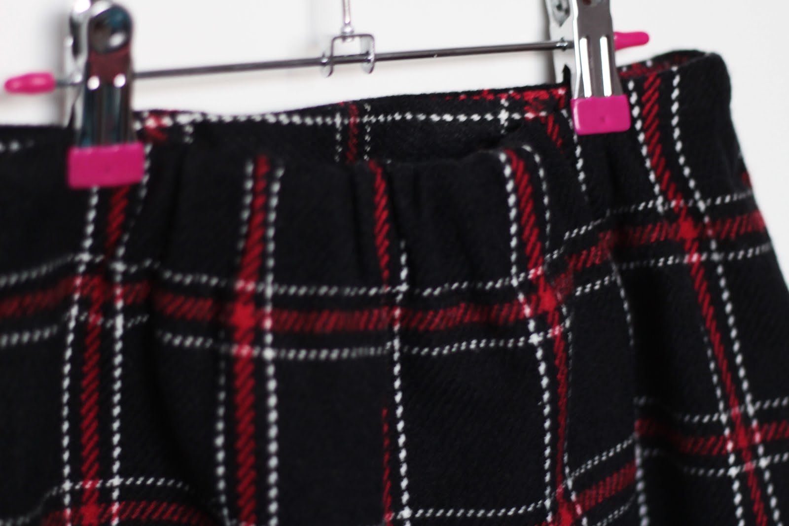 chuu check mini skirt raw hem button detailing