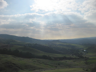 Sun rays break through the clouds over the foothills of Mt. Hamilton, Santa Clara County, California