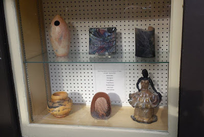 Student exhibit raku pottery pieces on display at Shadbolt Centre in Burnaby