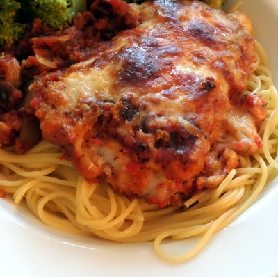 Chicken Parmesan:  Breaded chicken in a tomato sauce smothered in Parmesan and mozzarella cheeses.