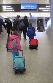 Children pulling their luggage