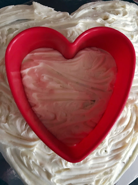Heart shaped cutter placed on to the cake