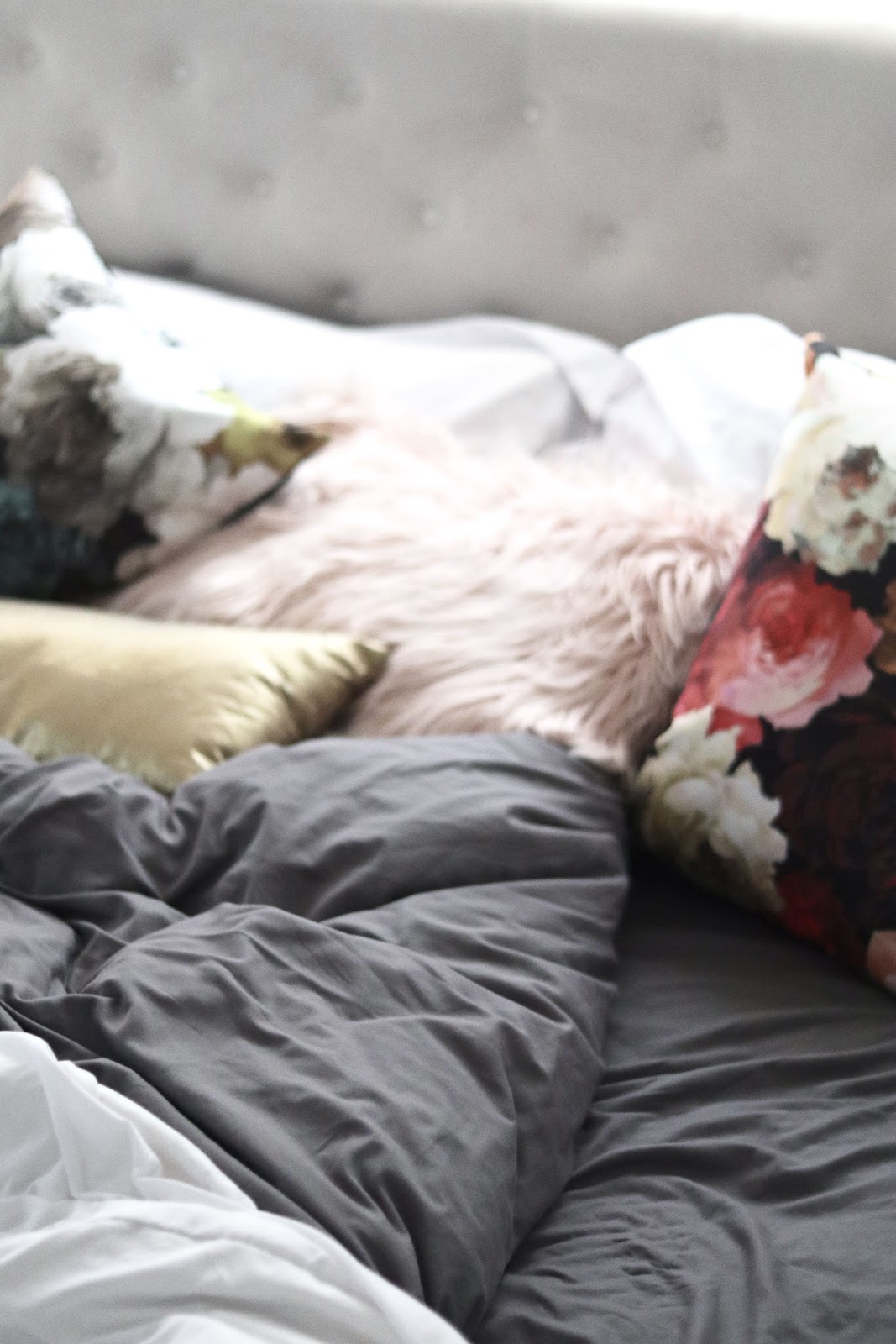Benji Sleep Bedding in grey and duvet cover in white paired with floral black pillows from HomeSense Benji Sleep Givaway Sheet Set and Duvet