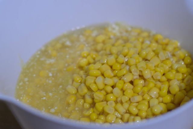 The Jiffy mix, cream corn, and sweet corn in a mixing bowl.  