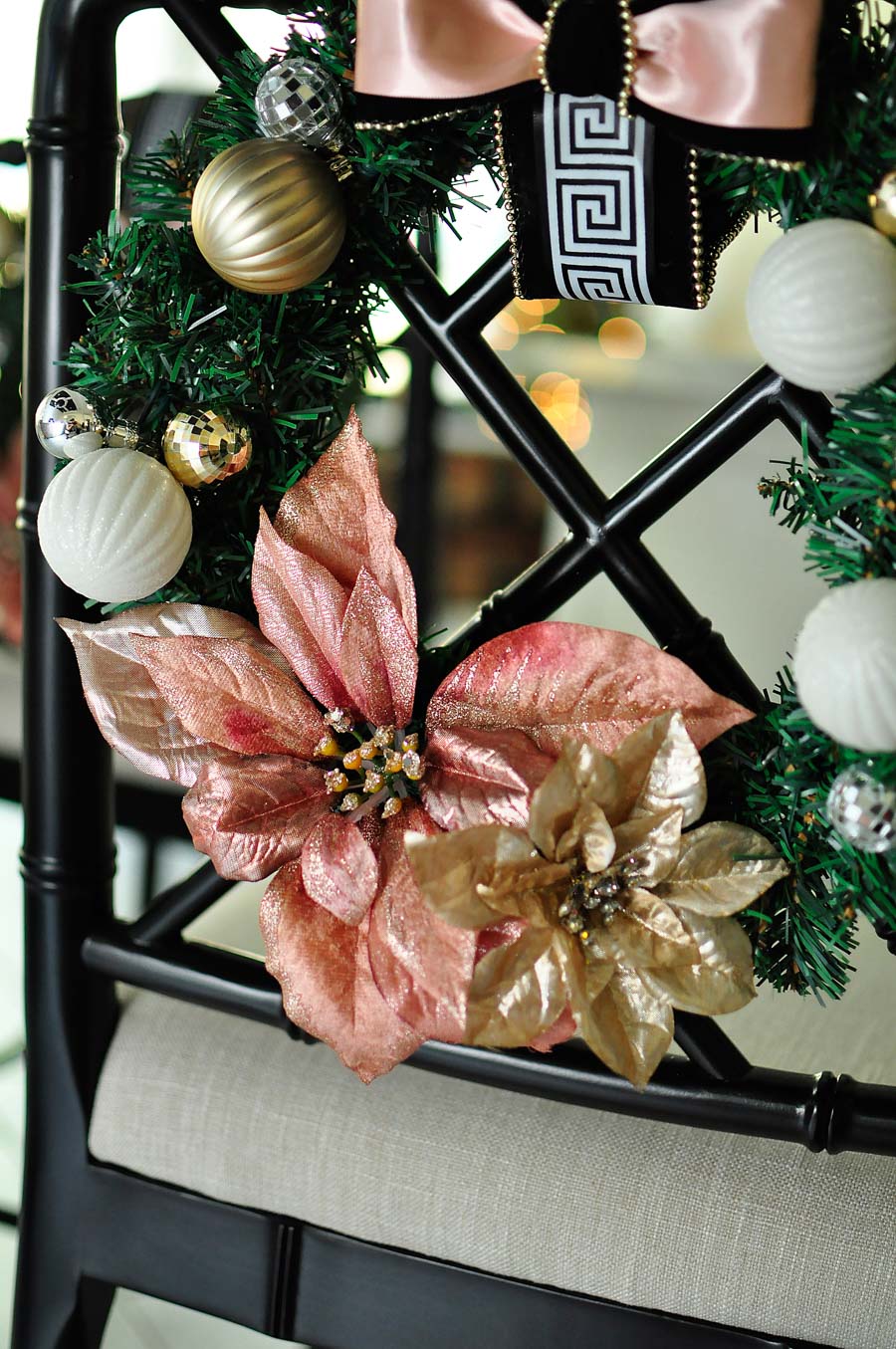 A craft tutorial for a gorgeous and glam blush, white, and gold chair wreath perfect for holiday and Christmas decor in a kitchen or dining room. Love the Greek Key accents! 