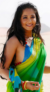 Anushka Shetty in Bikini Style Choli and Green Saree Smiling Face