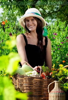 Caucasian Young Woman in a Hat Walking in the Garden